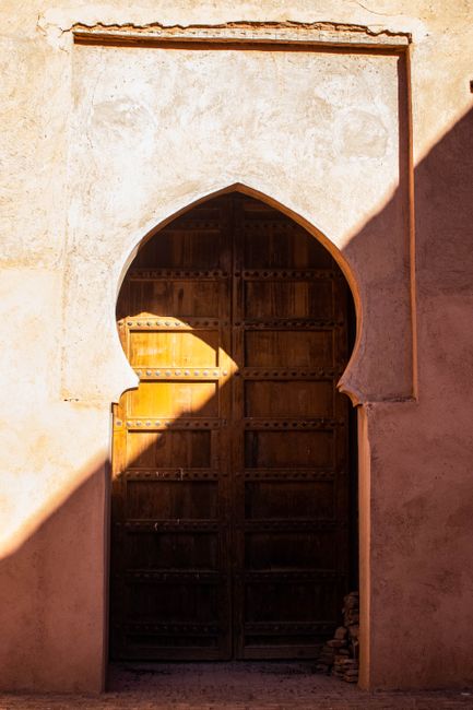 Explore the vintage charm of a Moroccan wooden door in Tinmel, highlighting cultural architecture.
