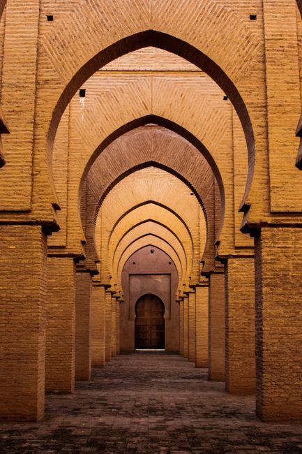 Captivating interior of Tinmel Mosque in Morocco showcasing intricate arches and architectural design.