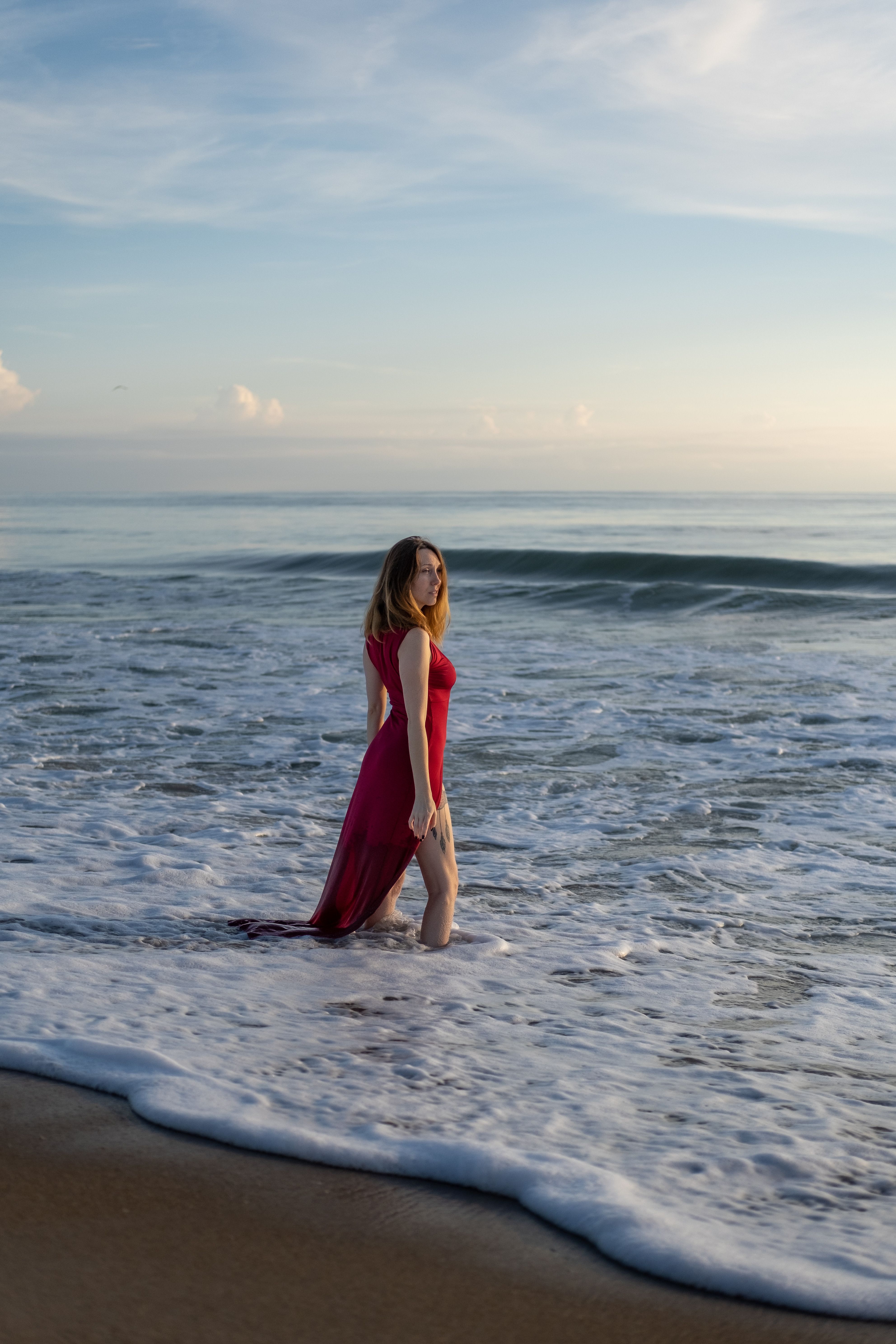 Woman in Red Dress Standing on Shore · Free Stock Photo