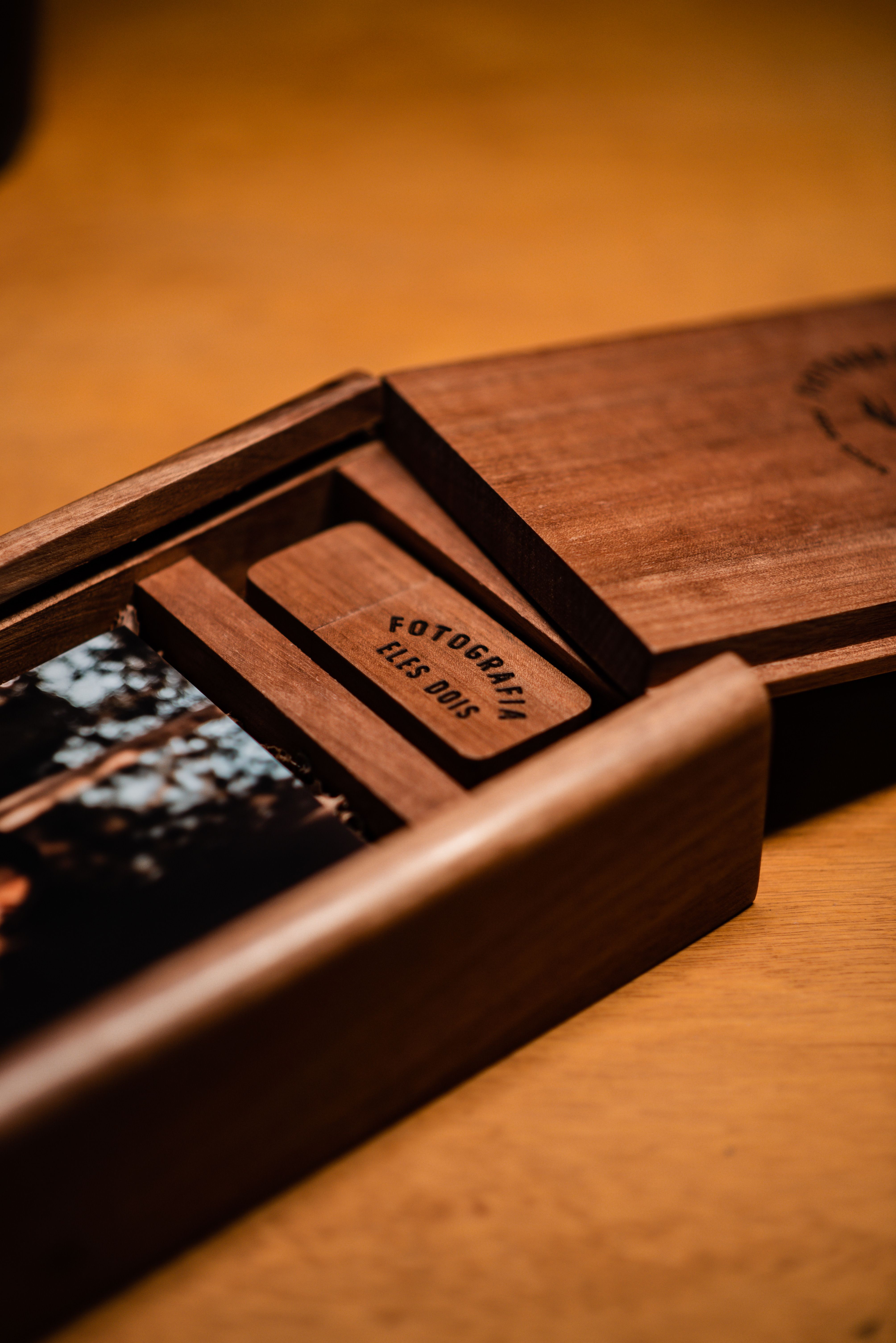 Beautiful wooden box containing printed photographs, perfect for keepsakes and gifts.