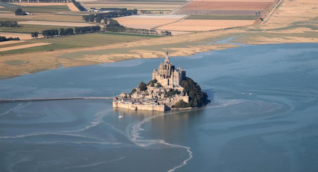 Stunning aerial view of Mont Saint-Michel in Normandie, a famous UNESCO World Heritage site.