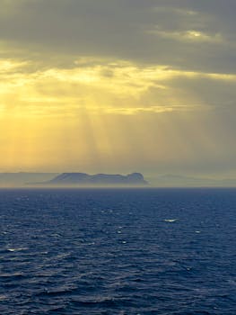 Dramatic sunset over the Strait of Gibraltar with picturesque sky and ocean.