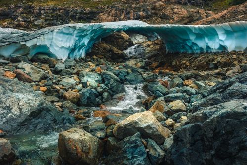 Free A breathtaking view of a glacier arch over rocky terrain in El Bolsón, Argentina, capturing nature's icy beauty. Stock Photo