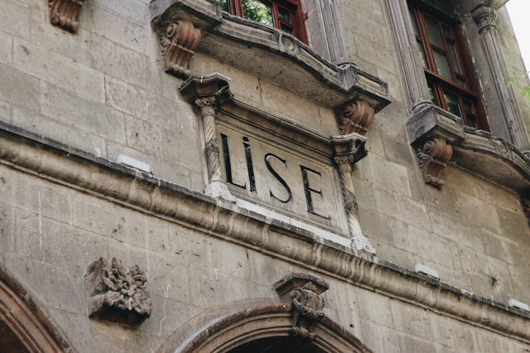 Letters Carved On A Building