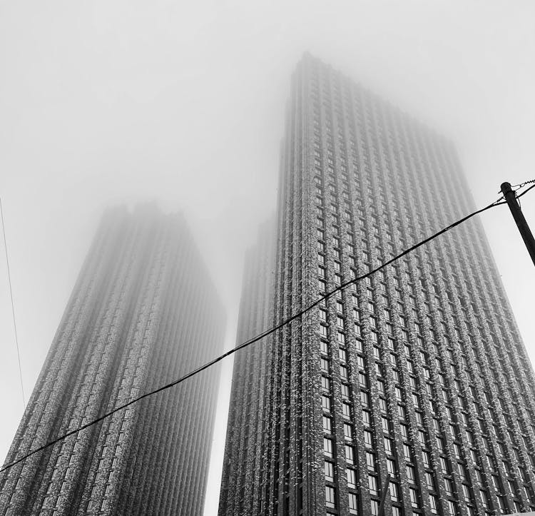 Skyscrapers In Snow On Sky Background