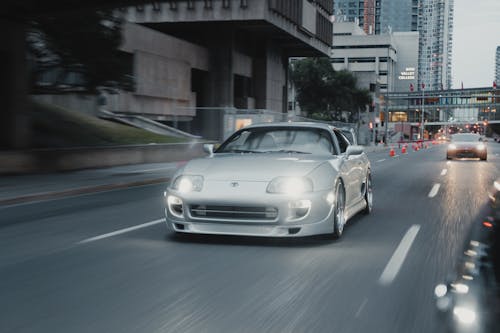 Shiny Sportscar Driving Dow  the Road