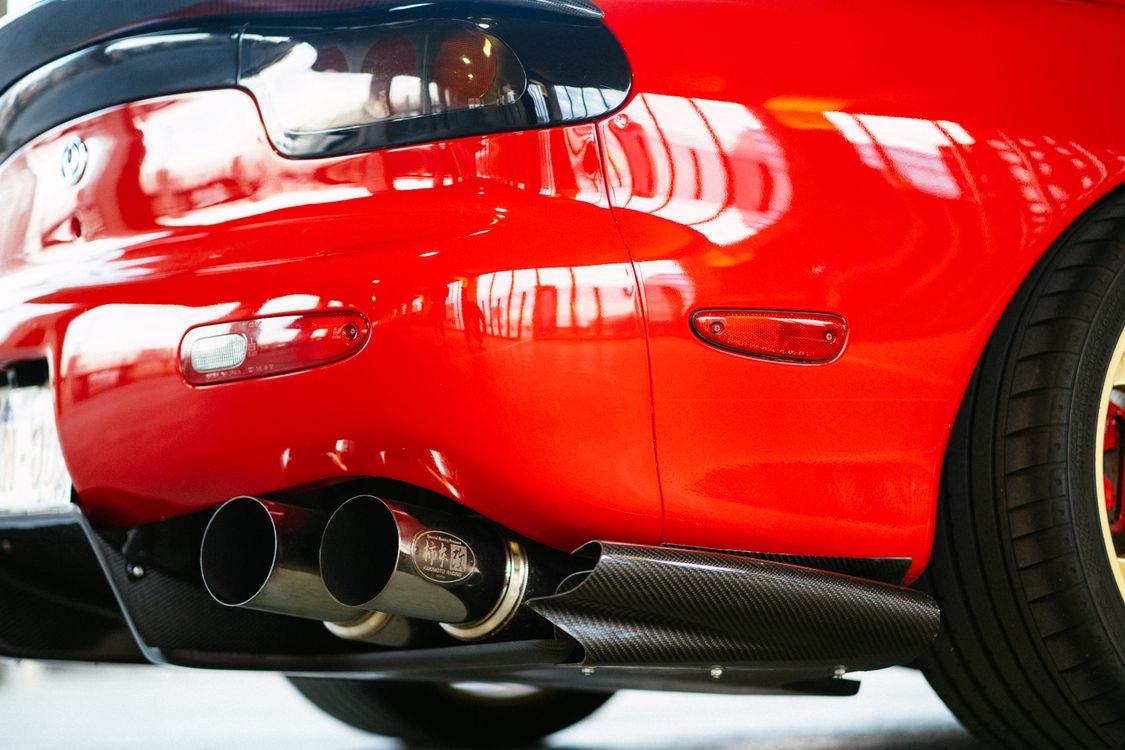 A Close-Up Shot of the Exhaust of a Mazda RX-7 · Free Stock Photo