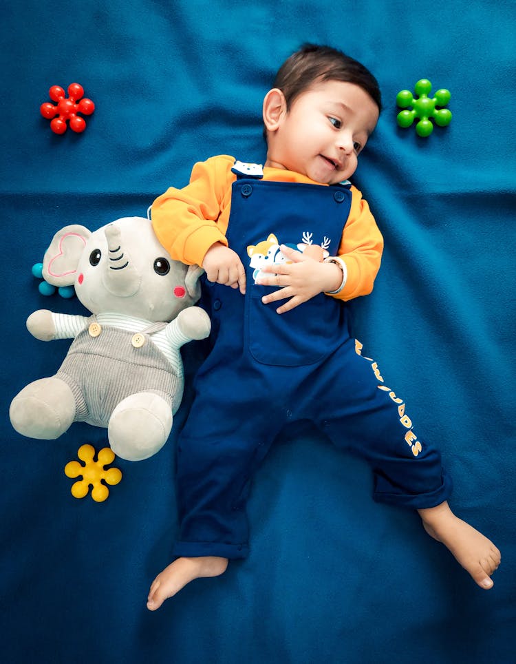 Baby Lying On A Blue Cloth