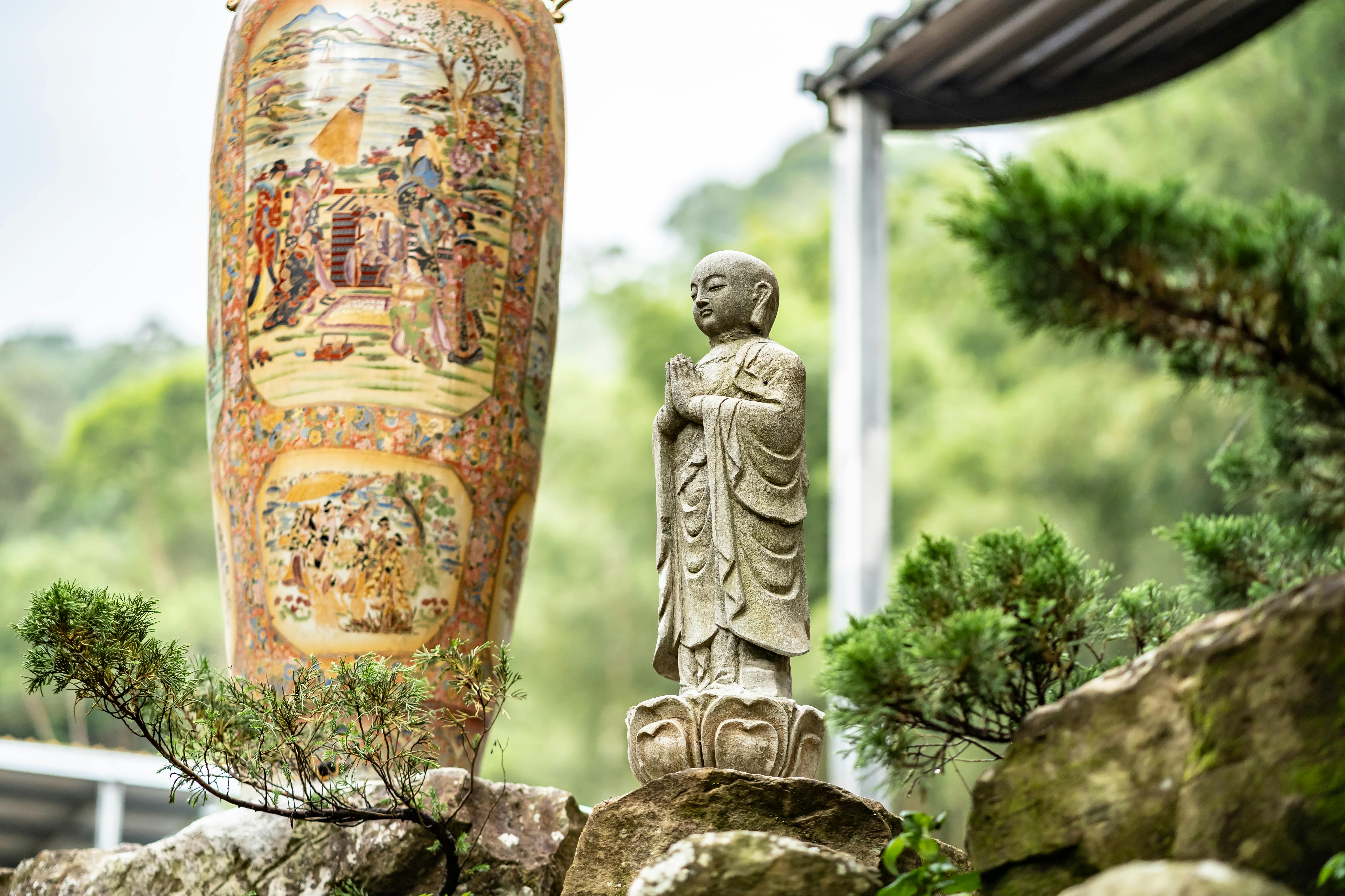 Gold Buddha Statue Near Tall Jar · Free Stock Photo