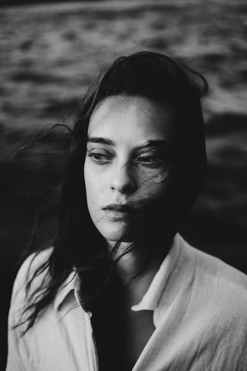 Grayscale Photography of a Woman Looking Afar