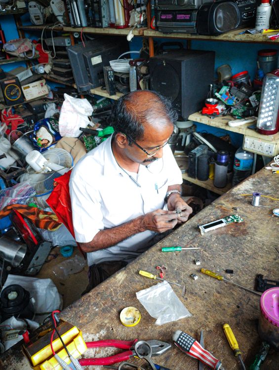 Men Fixing Tools High Angle View of a Man Fixing Tools · Free Stock Photo