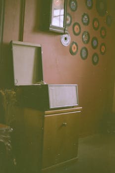 A vintage record player with a retro wall of vinyl records, creating a nostalgic atmosphere.