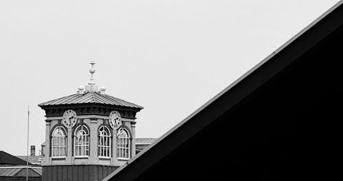 Clocks on Building in Black and White