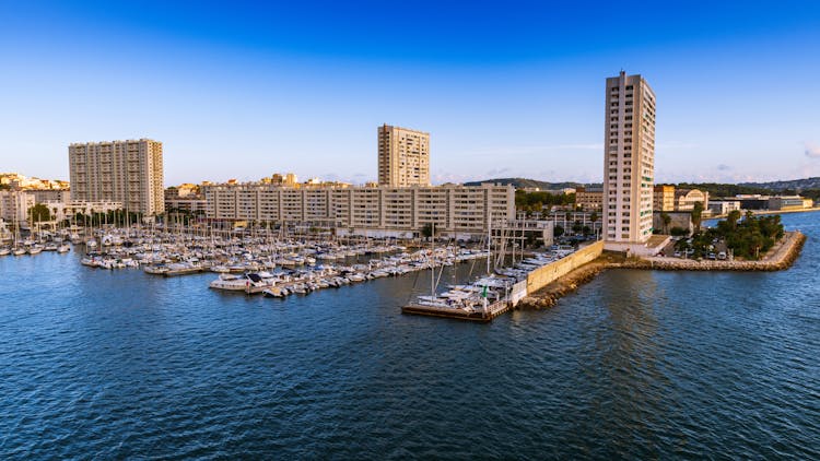 Boats At Pier In Port City