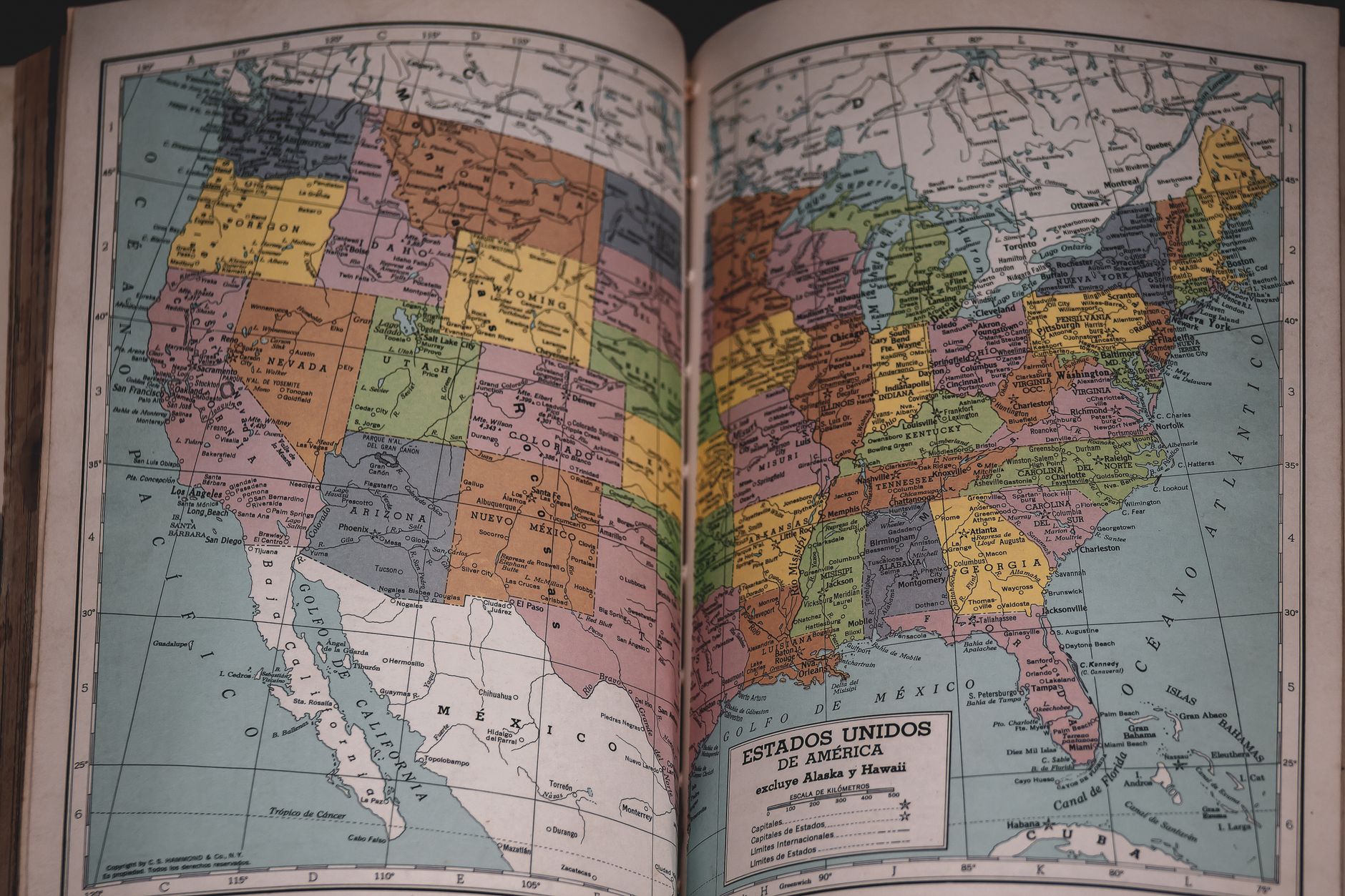 Classic vintage map of the United States in a historical book, showcasing detailed state borders.