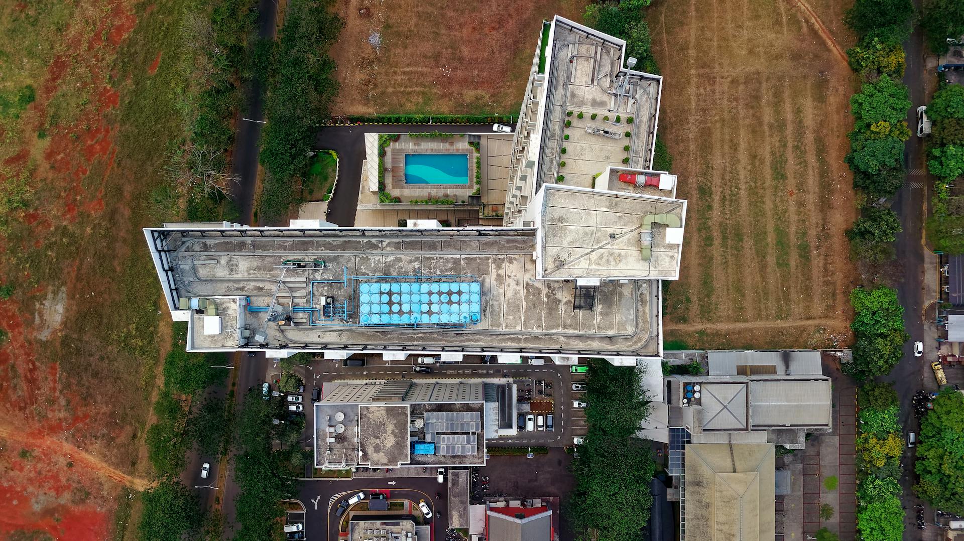 Drone shot of urban buildings and landscape in Sindang Jaya, Indonesia.