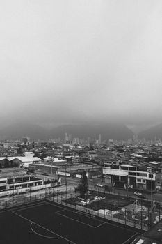 Explore a dramatic aerial view of an urban cityscape in black and white.