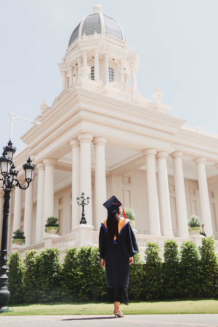 Graduate In Mantle Near University Building