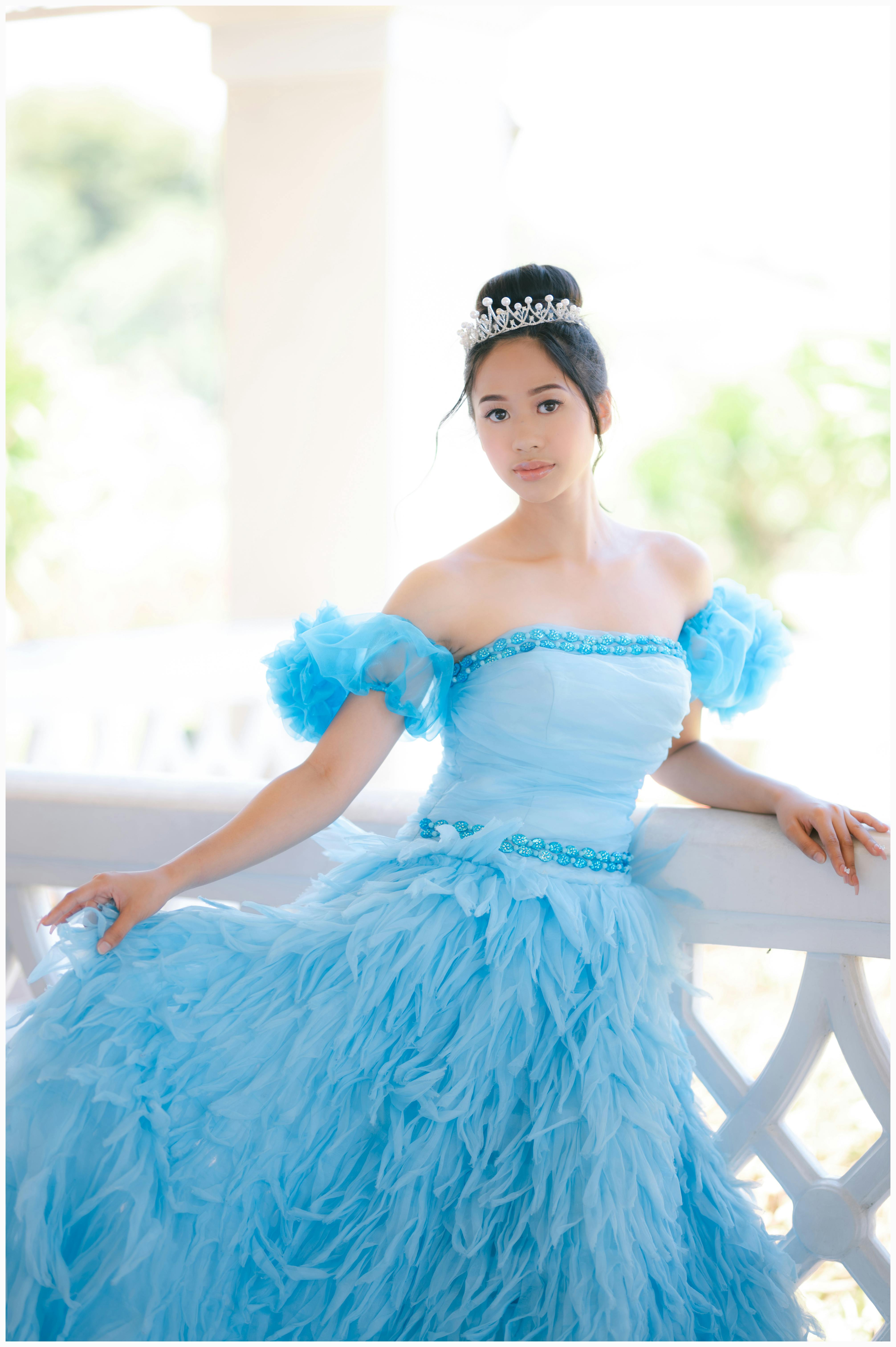 beautiful young girl wearing a tiara and a tulle dress
