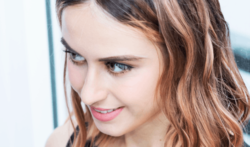 Close-up Photo of a Beautiful Woman Smiling