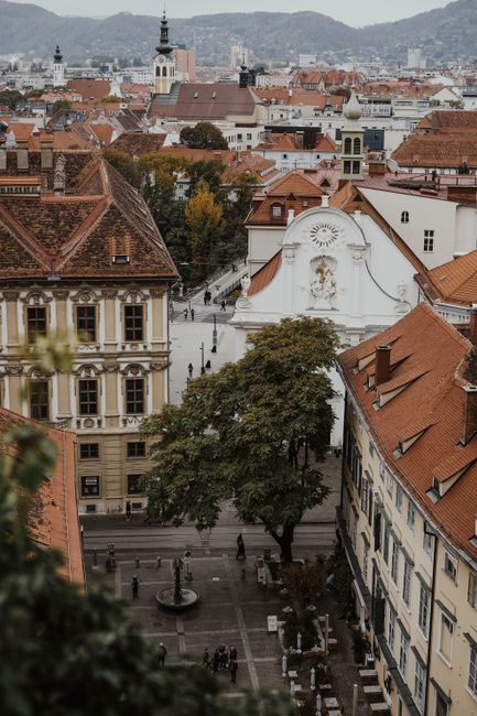 Explore Graz's architectural beauty from above, featuring historical rooftops and scenic views.