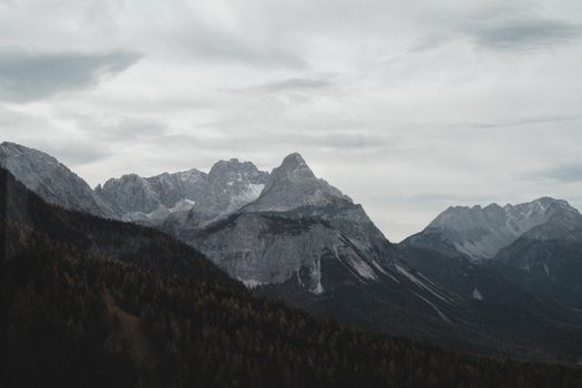 Explore the serene and foggy landscapes of Steiermark, Austria with towering alpine peaks.
