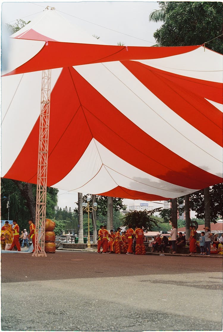 Group Of Dancers Below A Fabric Roof