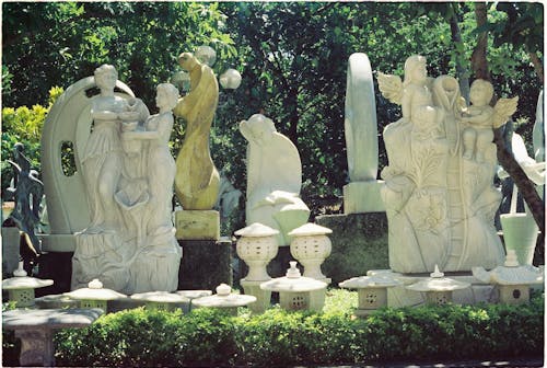 Free Marble Sculptures of People and Angels on Cemetery Stock Photo