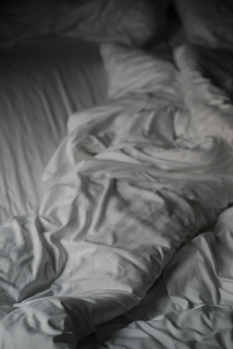 A White Blanket On Bed