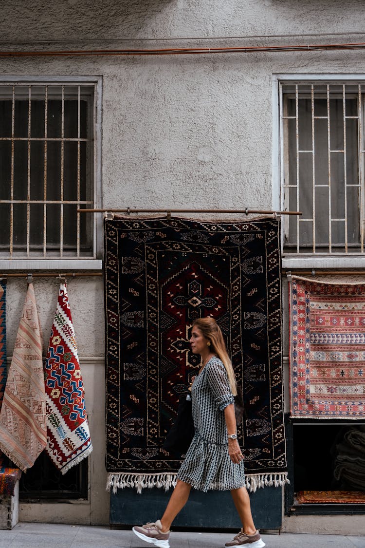 Carpets Hanging On Building On City Street