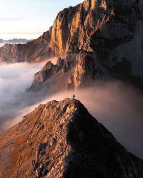 A breathtaking view of a mountain peak at sunrise in Colere, Lombardy, Italy.