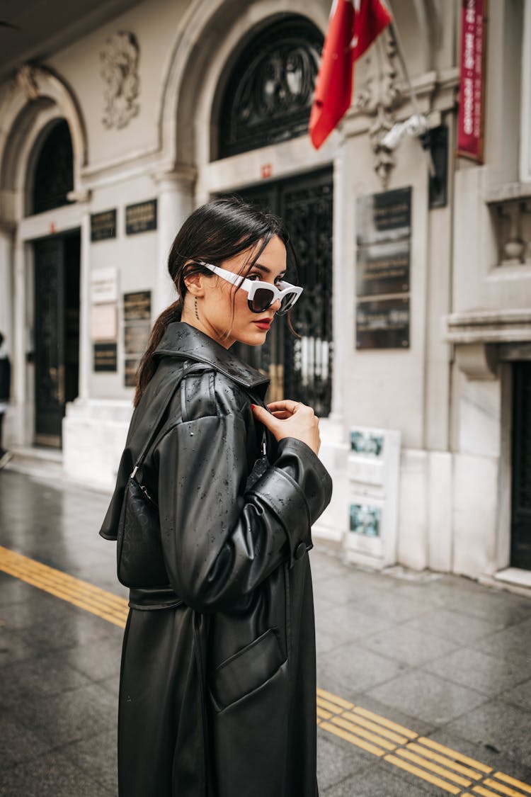 Woman Wearing Sunglasses And Black Leather Coat