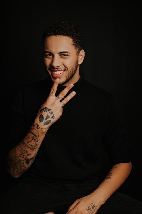 A Man with Arm Tattoo Smiling