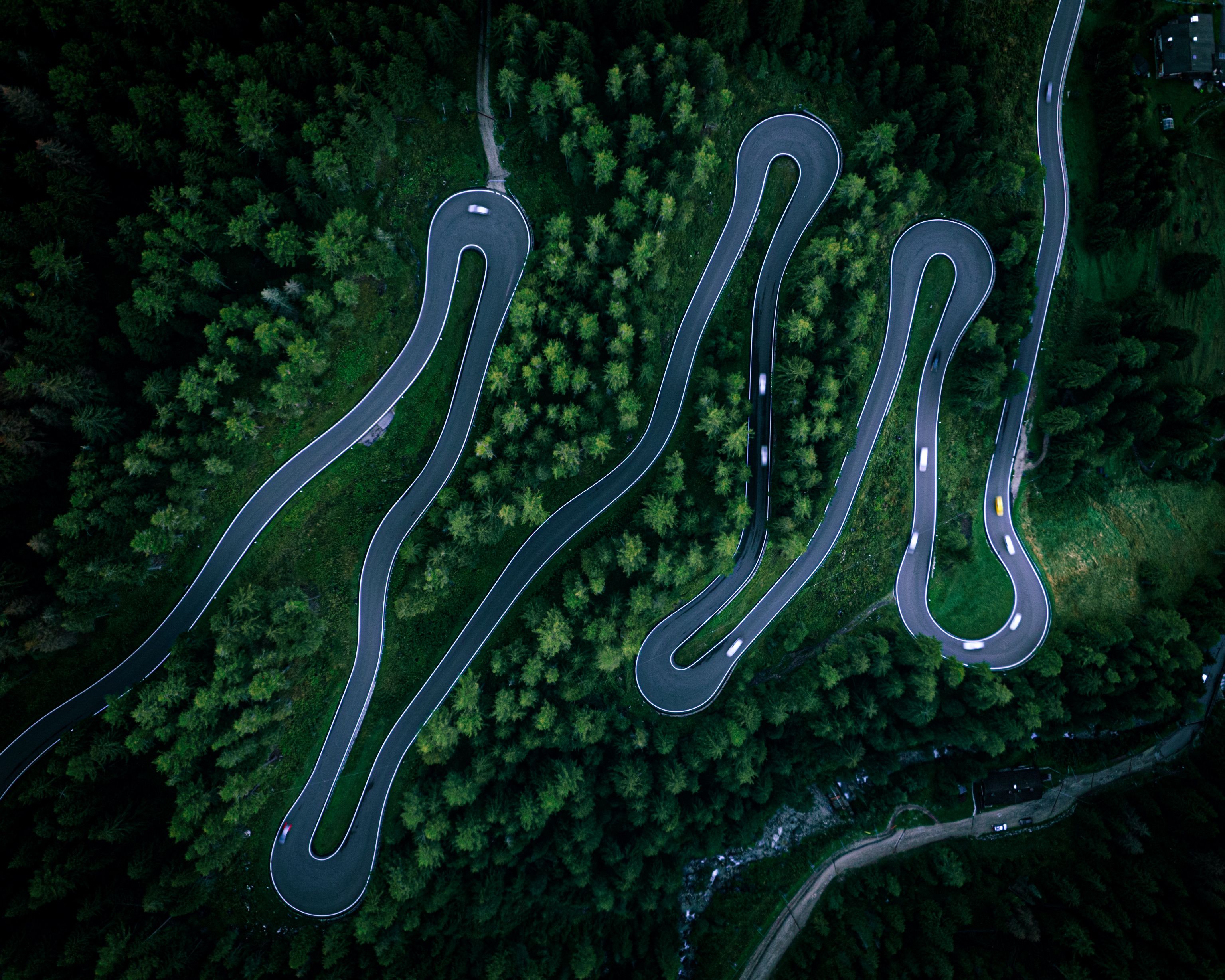 An Aerial View of a Concrete Curvy Road in the Mountain · Free Stock Photo