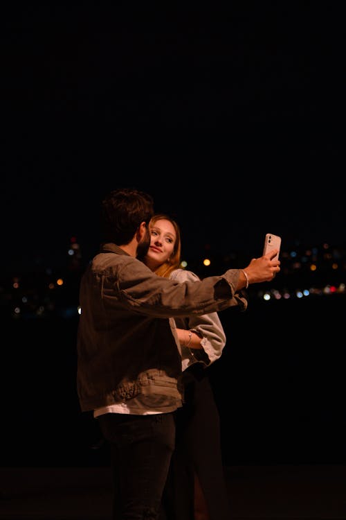 Man Kissing a Woman's Cheek