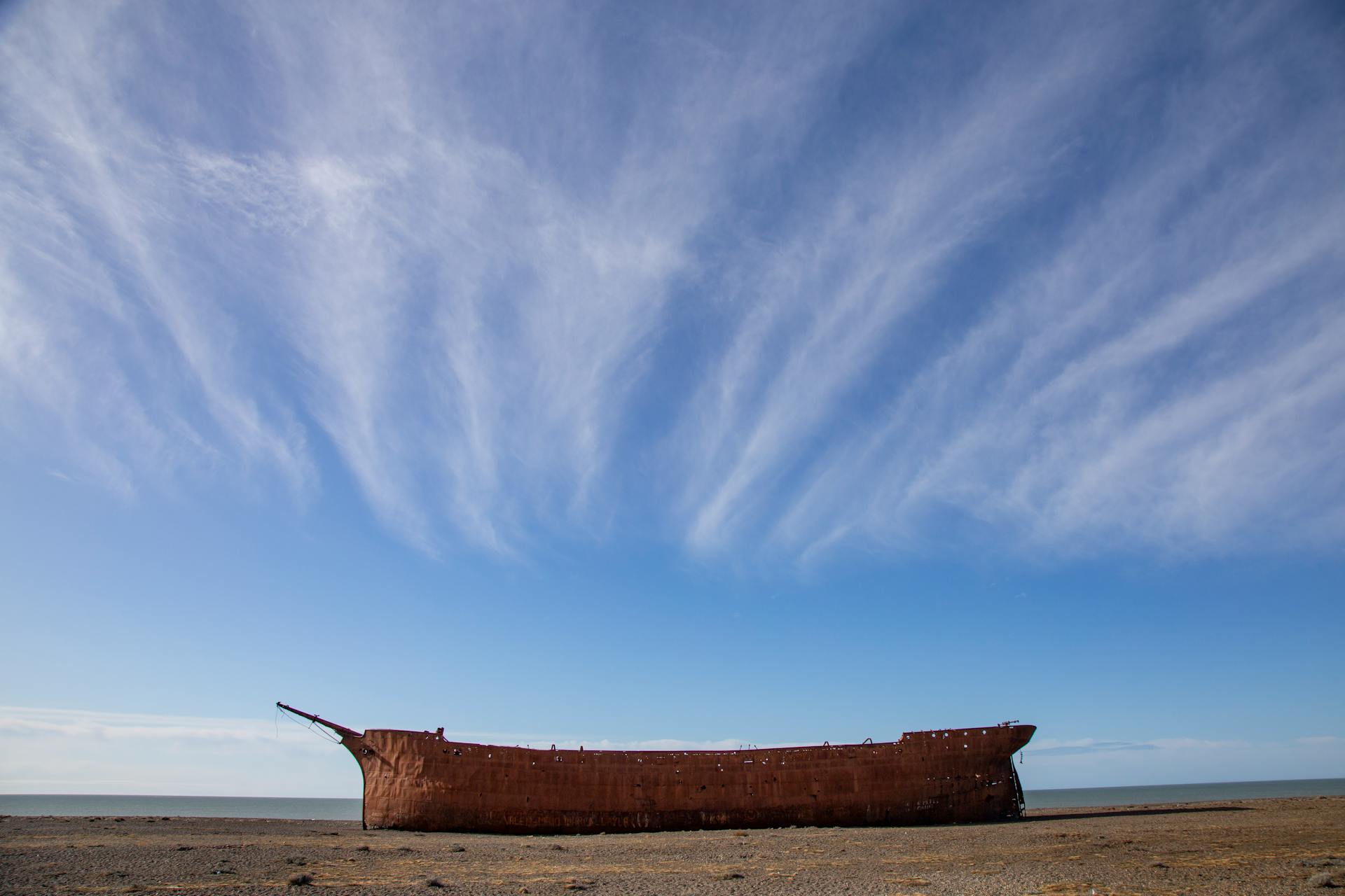 Historical shipwreck of Marjory Glen against a dramatic sky in Punta Loyola, Argentina.
