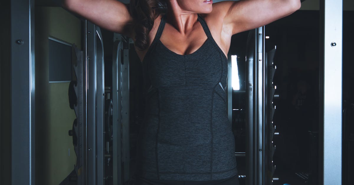 Woman Hanging on Gym Equipment on Focus Photo
