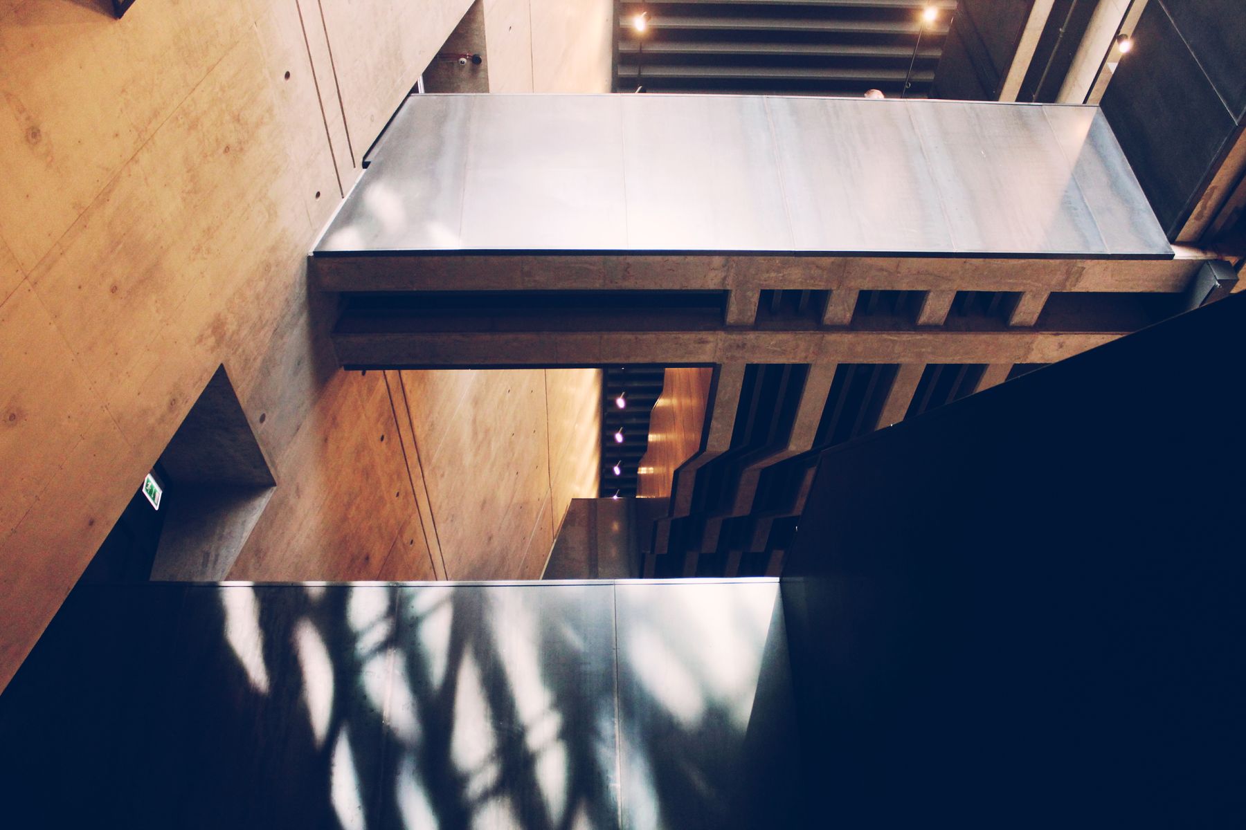 Contemporary interior with abstract shadows on concrete and metal