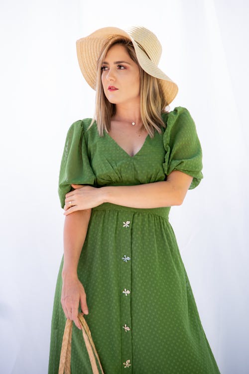 Beautiful Woman Wearing Green Dress and Sun Hat