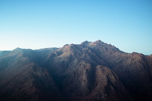 Aerial Photography of Brown Mountains under the Blue Sky