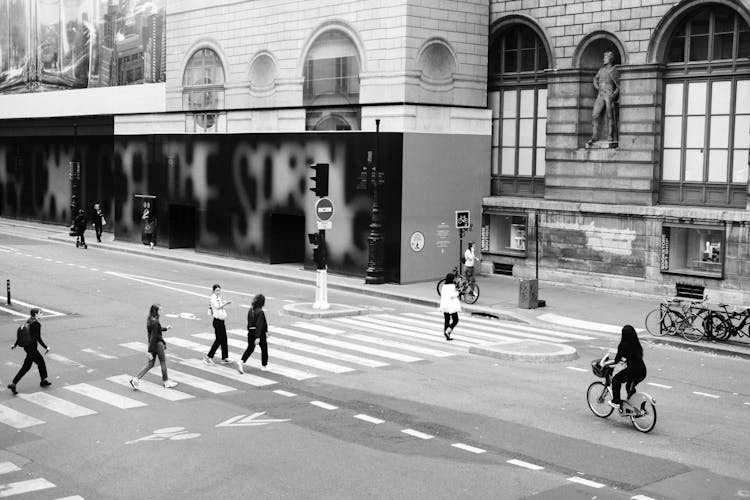 Pedestrians Crossing A Street In A City 