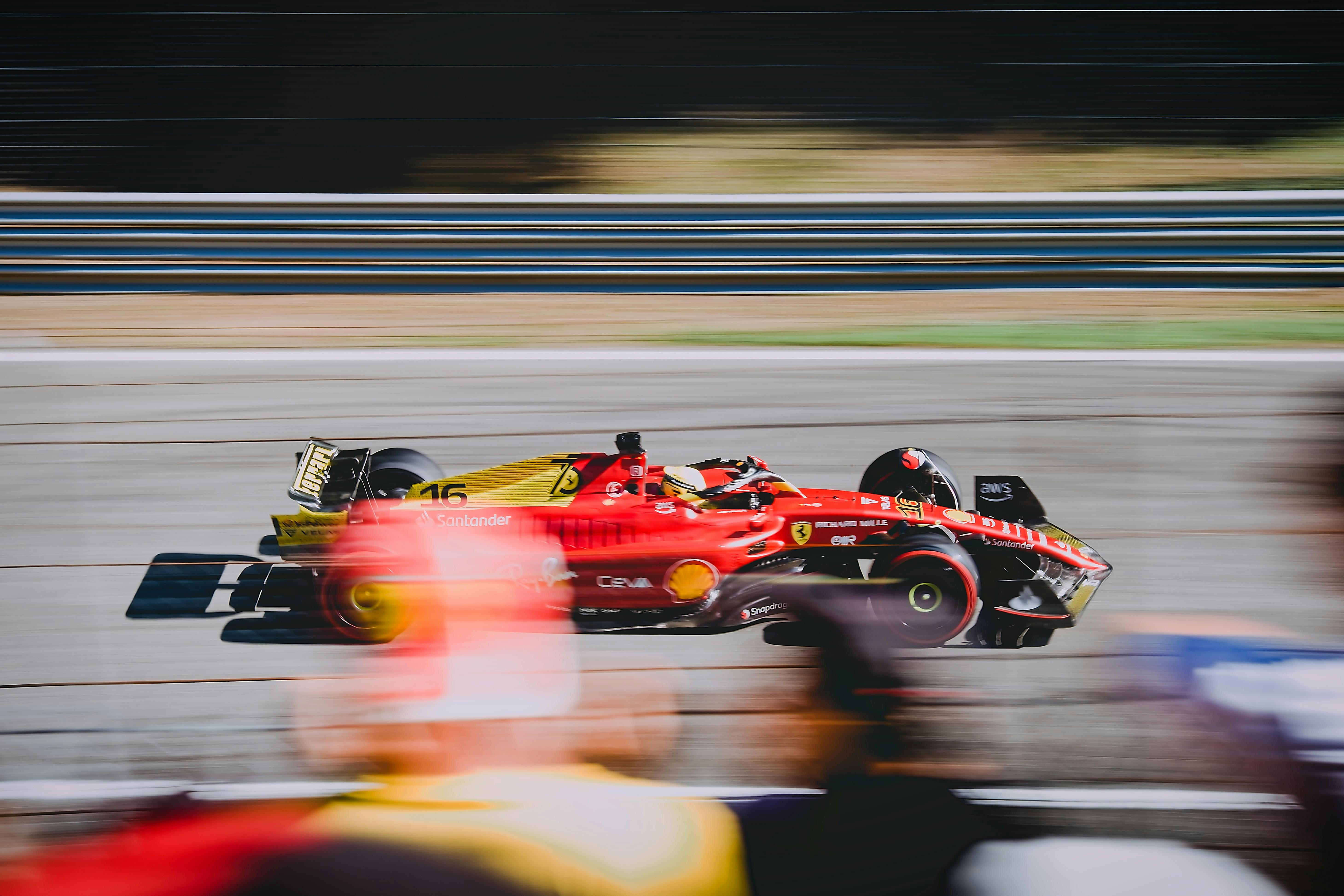 blurred motion of the scuderia ferrari race car driven by charles leclerc with a special livery for the