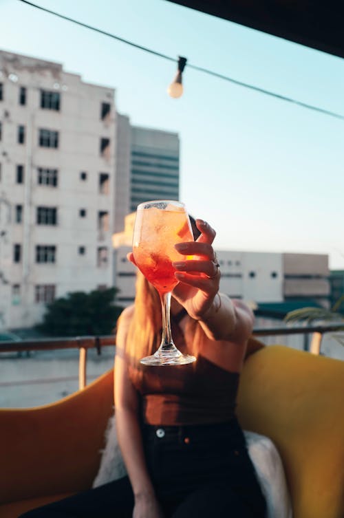 Close-Up Shot of a Woman Holding a Cocktail Drink