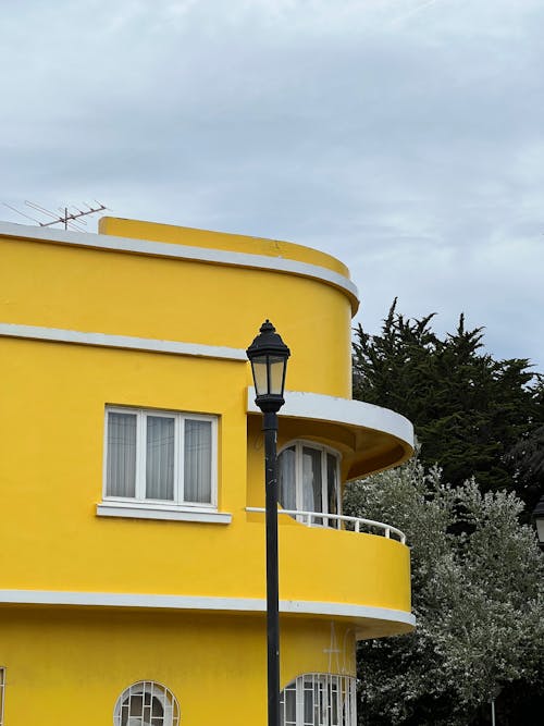 Facade of a Yellow Residential Building and a Lantern 