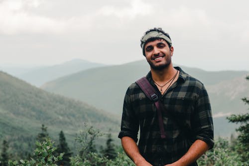 Man in Plaid Long Sleeves Smiling 