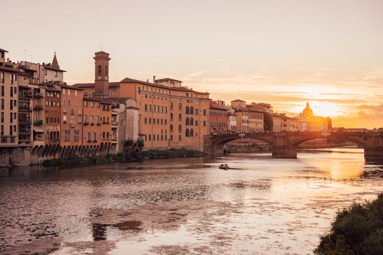 Brown Concrete Building Beside River