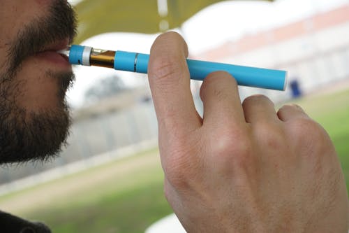 Free Close up of a man smoking from a vape pen Stock Photo