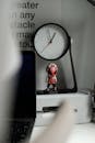 Analog Clock on White Desk
