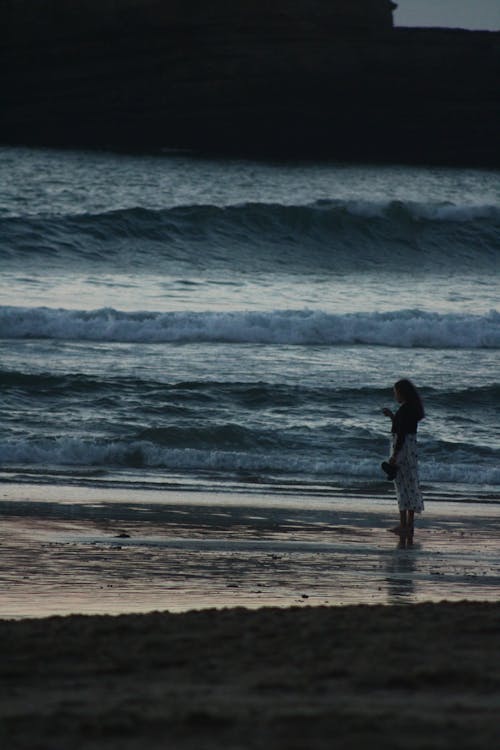 Woman Standing on the Sea Shore