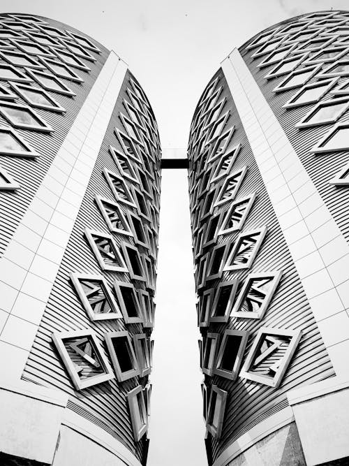 Grayscale Photo of High Rise Buildings